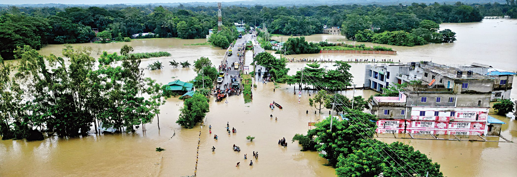 Following days of relentless rainfall and surging hill torrents, homes and roads across Bandarban town have been inundated. Most low-lying areas along the banks of the Sangu River are now submerged. The photograph was taken on July 12 by Md Rajib Raihan and sourced from The Daily Star, Bangladesh.